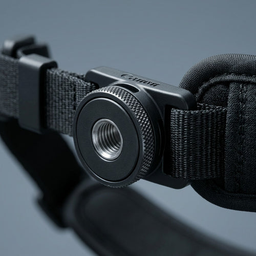 A detailed macro shot focusing on the high-quality textures and materials of the Canon Camera Hand Strap E2.
