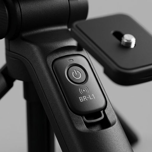Macro photograph focusing on the integrated controls and premium textured handle of the Canon HG-100TBR Tripod Grip.