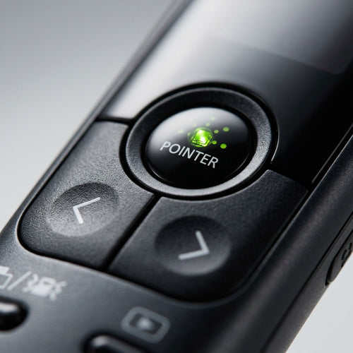 A macro shot isolating the PR10-G-BK presenter's central multi-control pad and green pointer button.