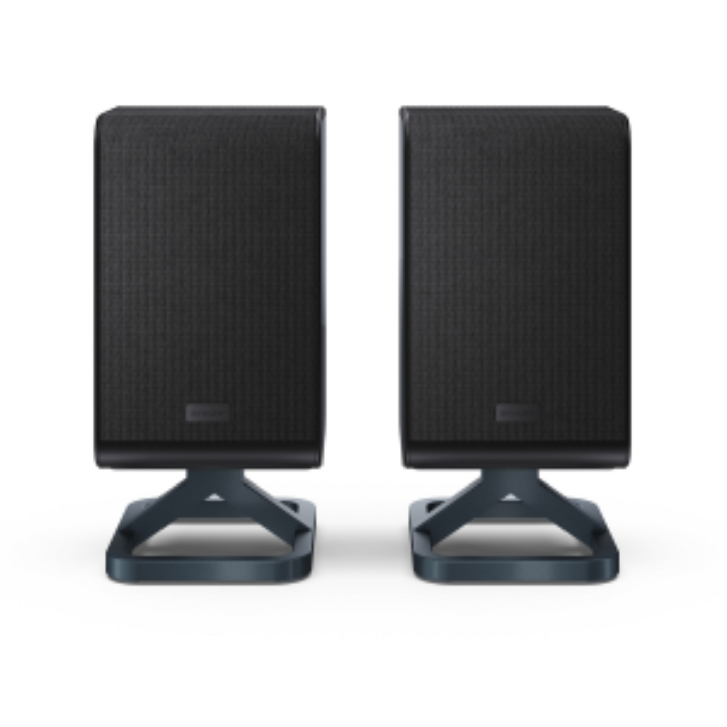 Pair of black Sharp wireless rear surround speakers with mesh grilles and angular desktop stands.