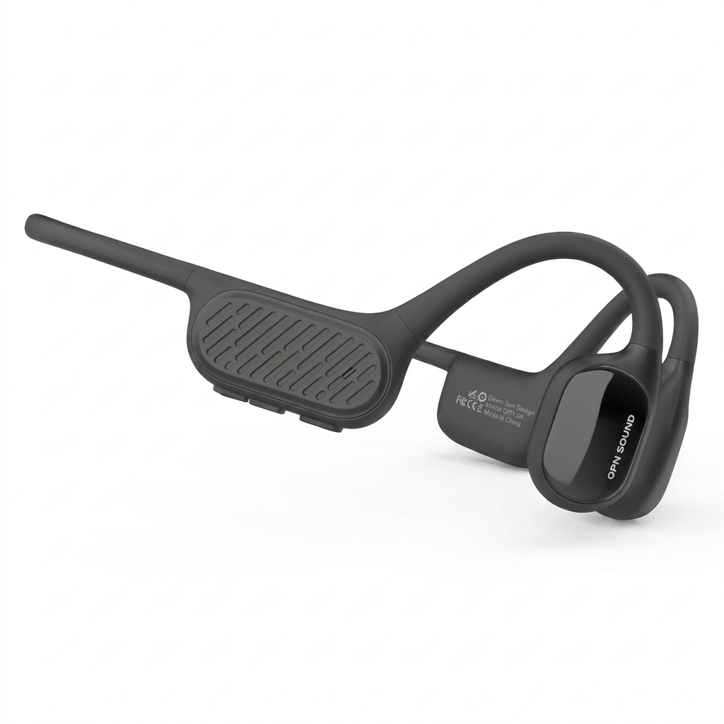 A photorealistic studio product photograph captures the OPN Sound Swym+ open-ear headphones in charcoal grey, angled to show the left side control panel and earpiece on a seamless pure white background with a soft shadow.