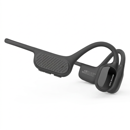 A photorealistic studio product photograph captures the OPN Sound Swym+ open-ear headphones in charcoal grey, angled to show the left side control panel and earpiece on a seamless pure white background with a soft shadow.