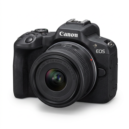 A photorealistic studio product photo of the black Canon EOS R50 mirrorless camera with the RF-S 18-45mm lens, angled right on a pure white background with a soft natural shadow.