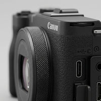 Macro close-up of Canon PowerShot V1 textured grip, multiway-control buttons, USB-C and HDMI ports.