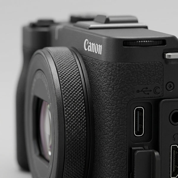 Macro close-up of Canon PowerShot V10 textured grip, multiway-control buttons, USB-C and HDMI ports.