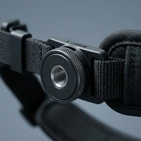 A detailed macro shot focusing on the high-quality textures and materials of the Canon Camera Hand Strap E2.