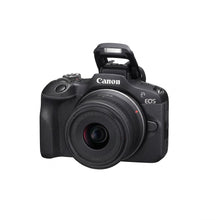 Hero shot of Canon EOS R100 camera with lens, on clean white background.