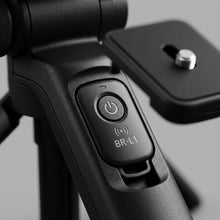 Macro photograph focusing on the integrated controls and premium textured handle of the Canon HG-100TBR Tripod Grip.