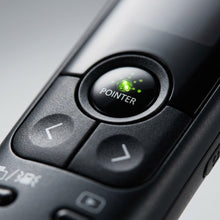A macro shot isolating the PR10-G-BK presenter's central multi-control pad and green pointer button.
