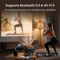 Dangbei N3 Max with Bluetooth 5.0 and Wi-Fi 5 connecting a smartphone and a wireless speaker during a home workout