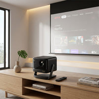 A lifestyle image showing the Dangbei DBOX02 Pro on a wooden media console, projecting Netflix.