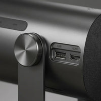 Extreme macro view captures the Dangbei Freedo projector's metal body texture, precision dial, and connection ports.