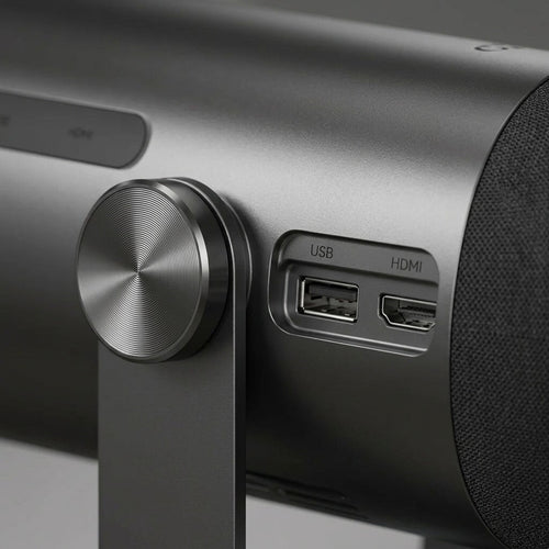 Extreme macro view captures the Dangbei Freedo projector's metal body texture, precision dial, and connection ports.
