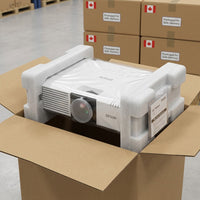 A photo displays the Epson V11H908020 projector securely packed in an open cardboard box with foam.