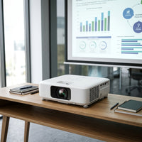 The Epson PowerLite L210SW short-throw laser projector in an office boardroom setting.