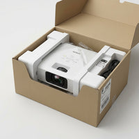 The EPSON PowerLite L210SW projector secured in protective cushioning within its shipping box ready for unboxing.