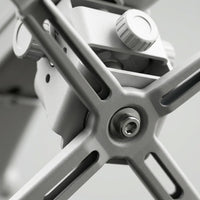 Macro view of Epson projector mount alignment mechanism showing precision bolts, gears, and materials