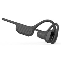 High-resolution hero shot of the dark gray OPN Sound Swym+ bone conduction headphones on a pure white background.