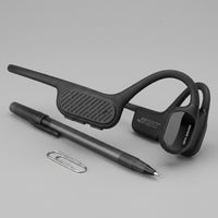 OPN Sound Swym+ headset beside a metal paper clip for size reference.