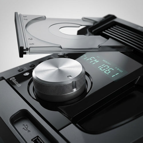 Macro photograph of the SHARP CD-BH950 multi-disc mechanism and volume knob.