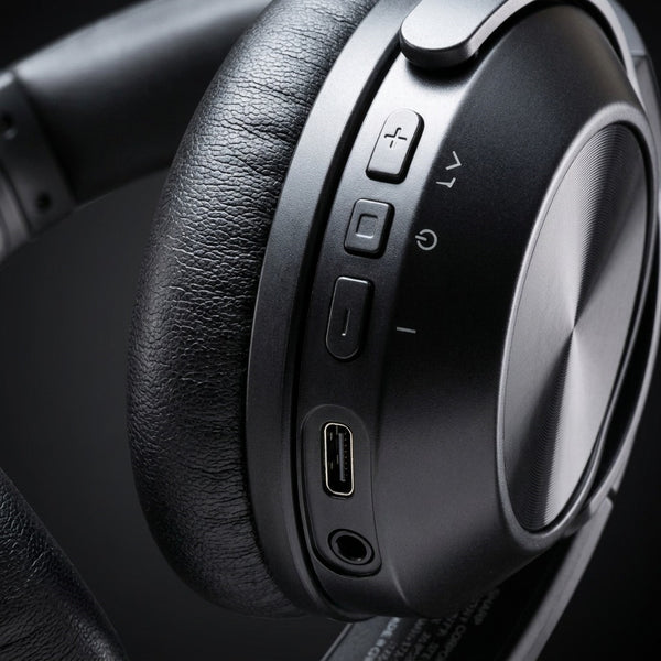 A detailed macro photograph showing the precise control interface and input panel on the SHARP HP-60 headphone earcup.