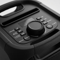 Extreme macro view of the Sharp PS-914 speaker top controls, showing knobs, buttons, and material textures.